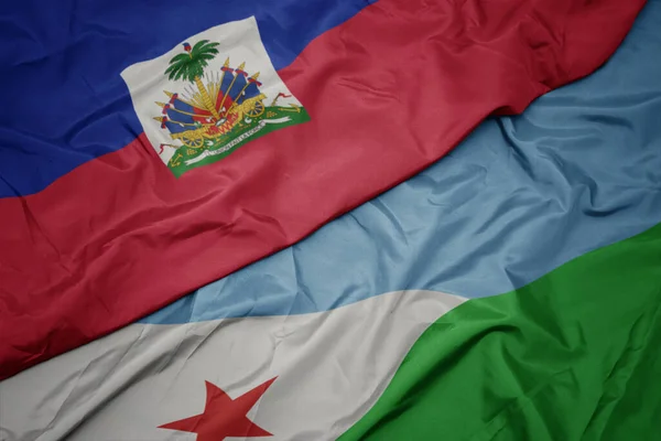 Κυματίζει Πολύχρωμη Σημαία Του Τζιμπουτί Και Εθνική Σημαία Της Αϊτής — Φωτογραφία Αρχείου