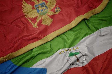 waving colorful flag of equatorial guinea and national flag of montenegro. macro.3d illustration