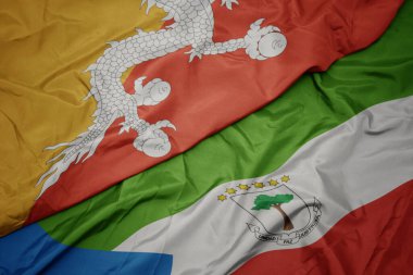 waving colorful flag of equatorial guinea and national flag of bhutan. macro.3d illustration