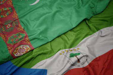 waving colorful flag of equatorial guinea and national flag of turkmenistan. macro.3d illustration