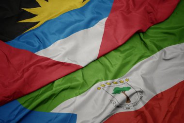 waving colorful flag of equatorial guinea and national flag of antigua and barbuda. macro.3d illustration