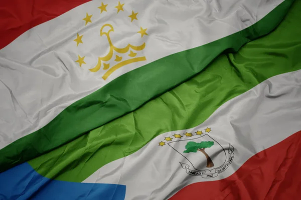 Размахивая Красочным Флагом Экваториальной Гвинеи Национальным Флагом Таджикистана Macro Иллюстрация — стоковое фото