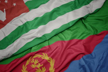 waving colorful flag of eritrea and national flag of abkhazia. macro.3d illustration