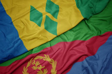 waving colorful flag of eritrea and national flag of saint vincent and the grenadines. macro.3d illustration