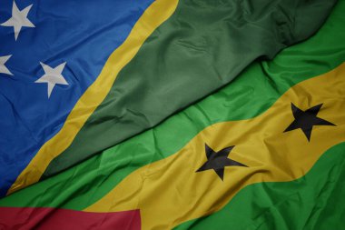 waving colorful flag of sao tome and principe and national flag of Solomon Islands . macro.3d illustration