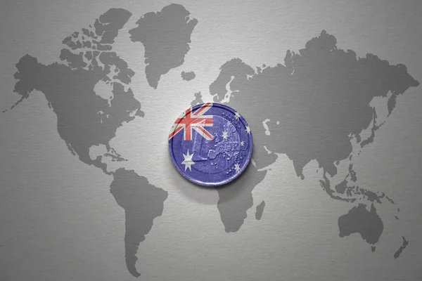 euro coin with national flag of australia on the gray world map background.3d illustration. finance concept