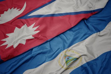 Nepal ve Nikaragua bayrağının renkli bayrağını sallıyordu. Makro. 3d illüstrasyon