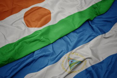 Nikaragua 'nın renkli bayrağını ve ulusal bayrağını sallıyordu. Makro. 3d illüstrasyon