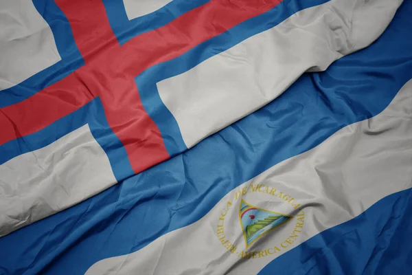 Viftande Färgglada Flagga Faroe Öar Och Nationell Flagga Nicaragua Makro — Stockfoto