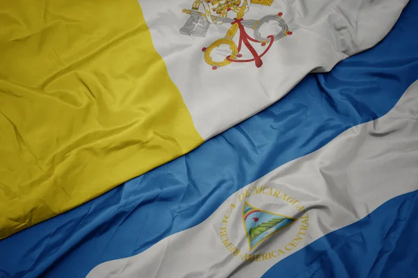 Színes Vatikáni Zászlót Lobogtatva Nicaragua Nemzeti Zászlaját Lobogtatva Makró Illusztráció — Stock Fotó