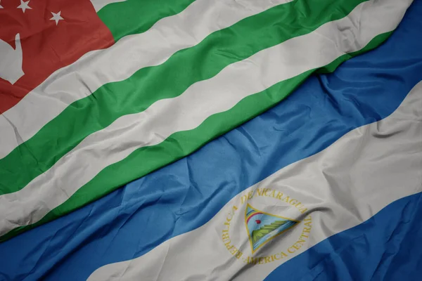 Mávající Barevnou Vlajkou Abcházie Státní Vlajkou Nikaraguy Makro Ilustrace — Stock fotografie