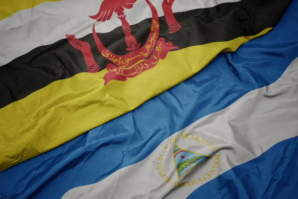 Mává Barevnou Vlajkou Bruneje Národní Vlajkou Nikaraguy Makro Ilustrace — Stock fotografie