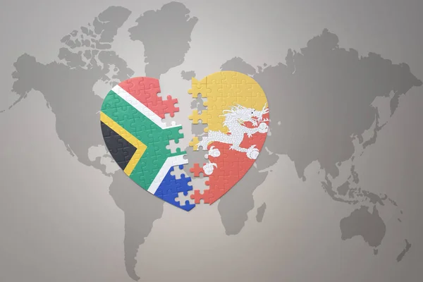 Puzzleherz Mit Der Nationalflagge Südafrikas Und Bhutans Auf Einer Weltkarte — Stockfoto