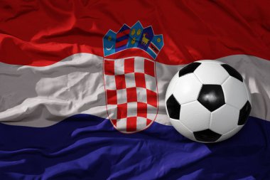 Hırvatların arka planında sallanan eski bir futbol topu. 3B illüstrasyon