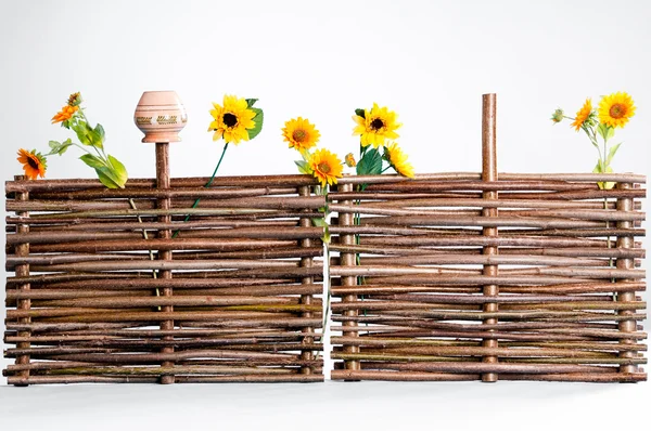 Traditional ukrainian wattle with sunflowers and pot — Stock Photo, Image