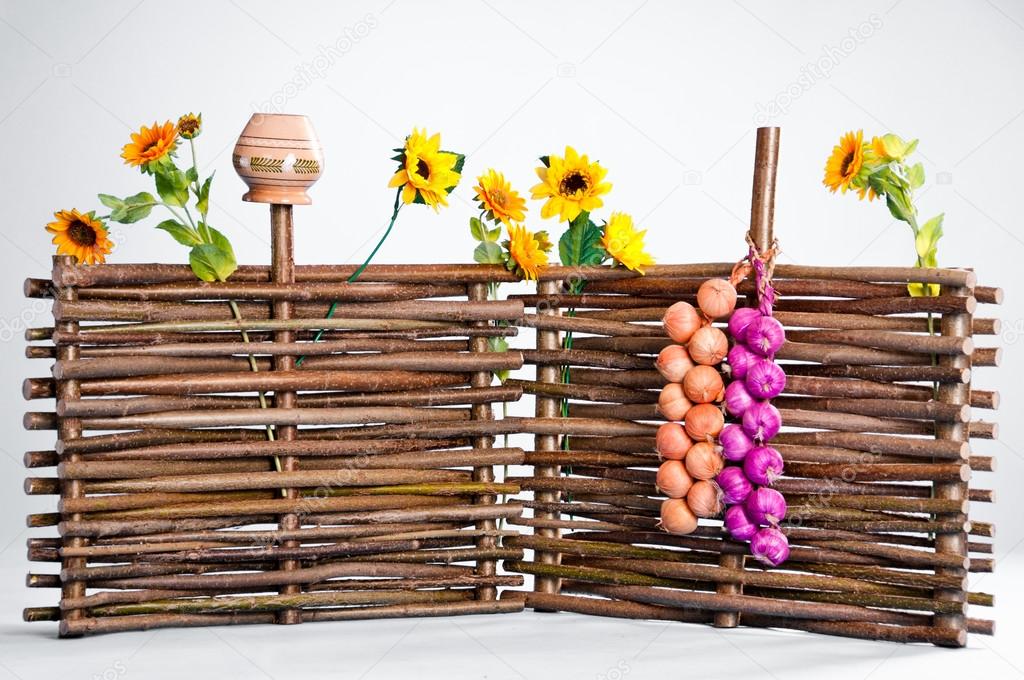 Traditional ukrainian wattle with sunflowers and pot