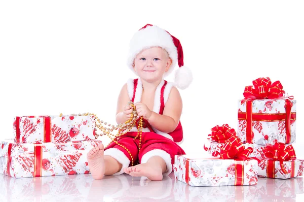 Little boy Santa Claus with Christmas gifts on a white backgroun — Stock Photo, Image