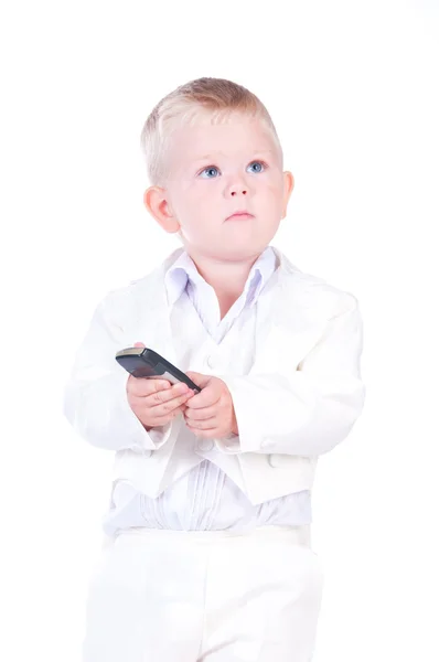 Kleine zakenman in een bedrijf pak met telefoon in de hand — Stockfoto