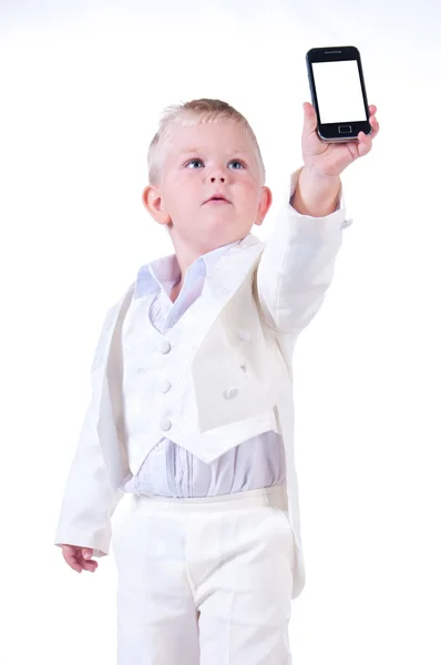 Kleine zakenman in een bedrijf pak met telefoon in de hand — Stockfoto