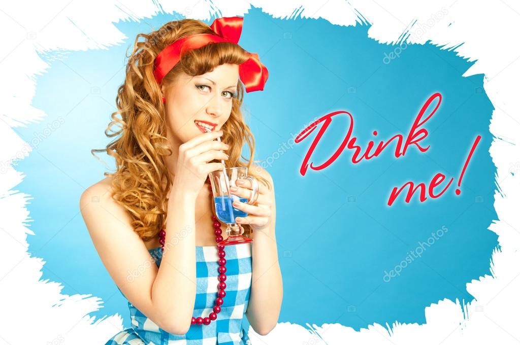 Cute Lovely redhead pin-up girl drinks a drink from tube