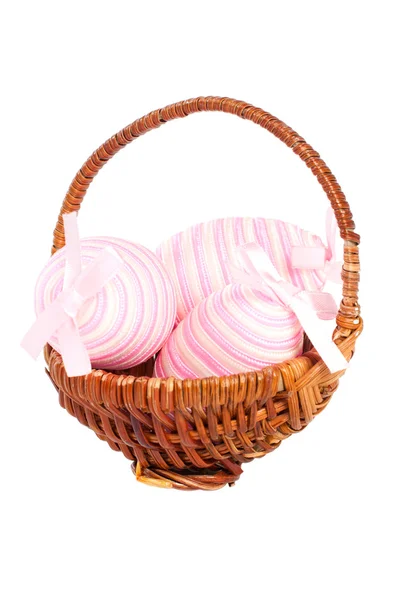 Basket with ornamental eggs on a white background. — Stock Photo, Image