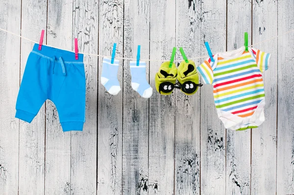 Baby clothes hanging on the clothesline. — Stock Photo, Image