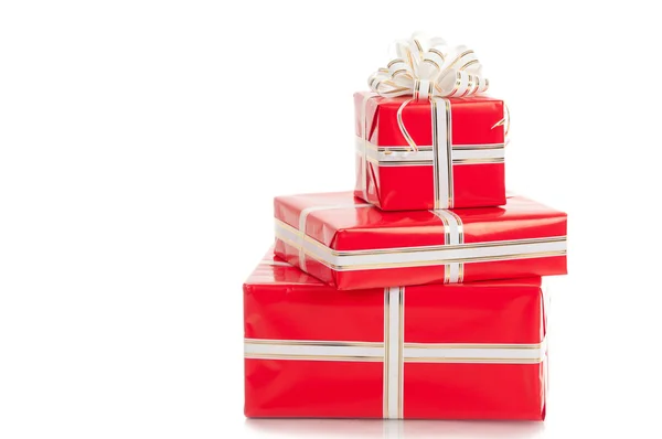 Wrapped gifts with a bow on a white background. — Stock Photo, Image