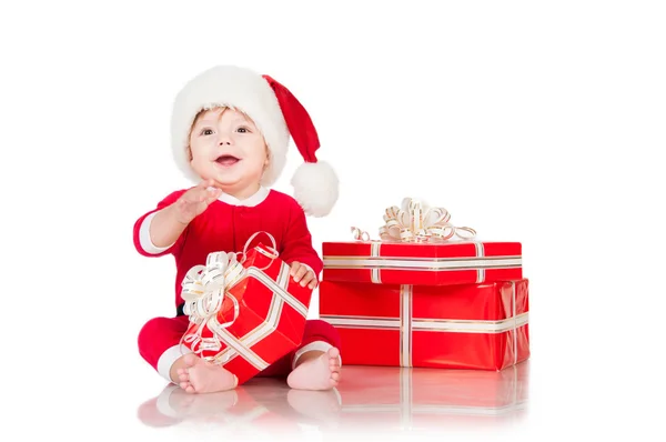 Cheerful little Santa Claus with presents. Isolated on white background. — Stock Photo, Image