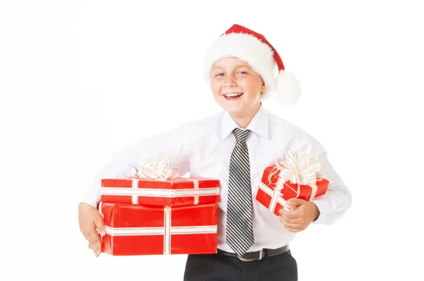 Szczęśliwy chłopiec w kapeluszu Boże Narodzenie prezenty. — Zdjęcie stockowe