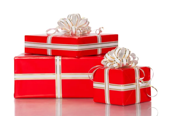 Wrapped gifts with a bow on a white background. — Stock Photo, Image