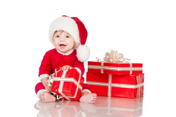 Cheerful little Santa Claus with presents. Isolated on white background. — Stock Photo, Image