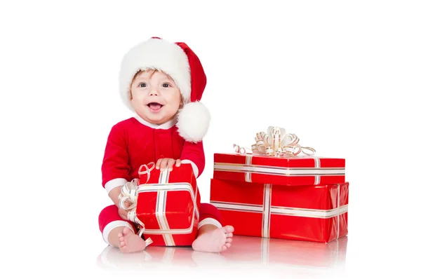 Cheerful little Santa Claus with presents. Isolated on white bac — Stock Photo, Image