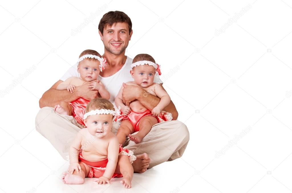 Happy father and little daughter triplets
