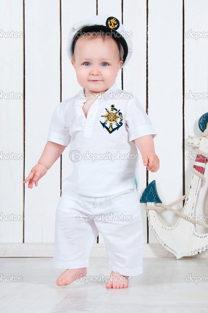 Kid captain, little baby boy dressed as a sea captain