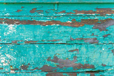  Eski kahverengi ahşap desenli, mavi çatlamış boyalı, yakın plan..