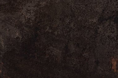 Koyu kahverengi engebeli sert yüzey, paslı demir zemin. Yüksek kalite fotoğraf