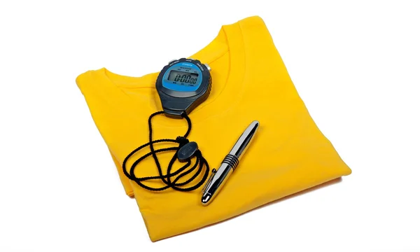 T-shirt, relógio de parada digital e caneta esferográfica — Fotografia de Stock