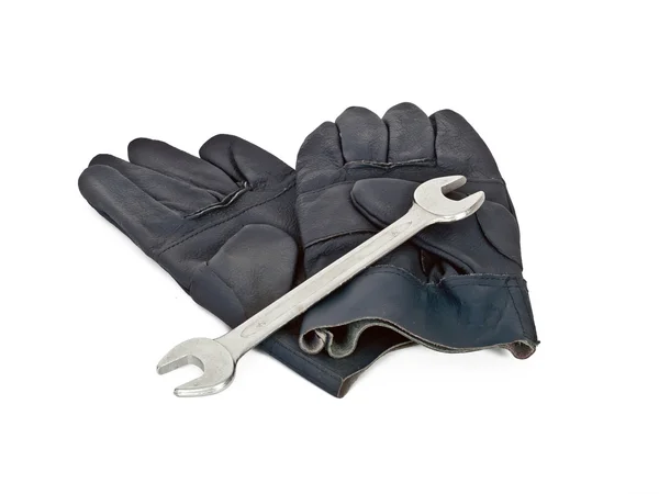 Handskar och skiftnyckel — Stockfoto