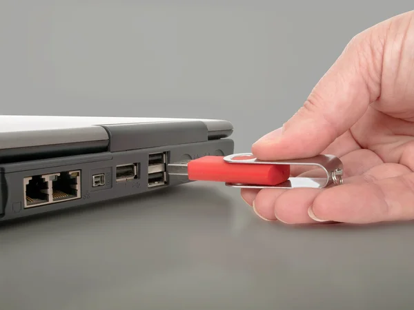 Inserting usb memory stick — Stock Photo, Image