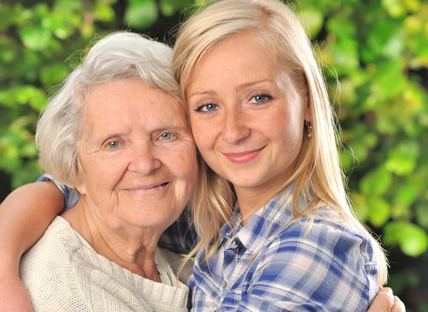 Grandmother and granddaughter. Senior and young woman outdoors. — Stock Photo, Image