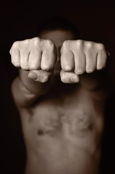 Two human fists as a symbol of aggression. — Stock Photo, Image