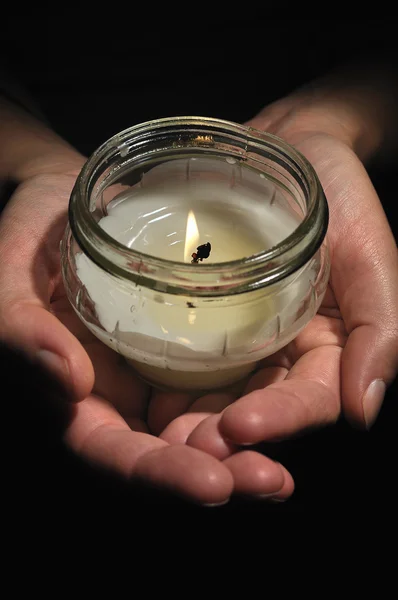 Candle in hands. — Stock Photo, Image