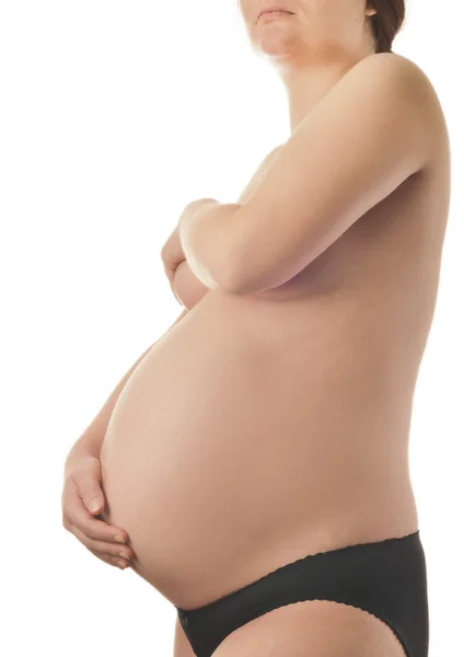 Pregnant woman with hands over tummy at white background — Stock Photo, Image