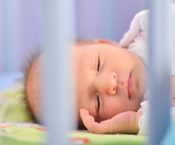 Infant lying in her bed. — Stock Photo, Image
