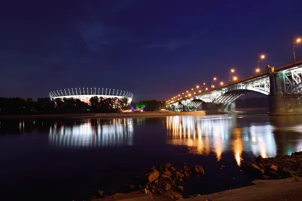 Poniatowski Bridge and National Stadium in Warsaw by night. — Stock Photo, Image