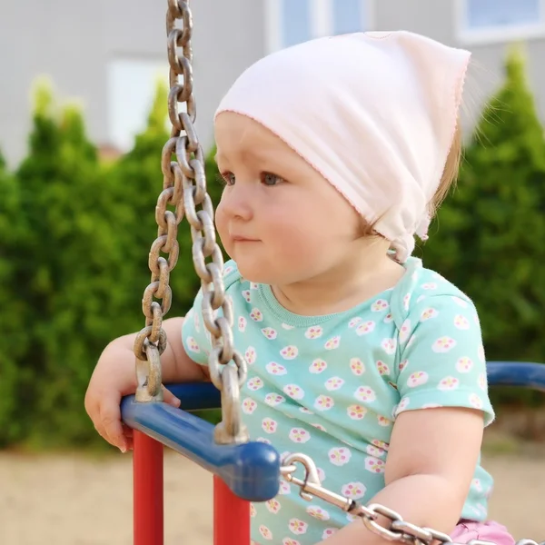 Cute baby on swing. — Stock Photo, Image