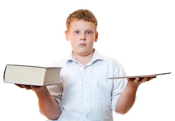 Chlapec s knihou a počítačem na tablet — Stock fotografie