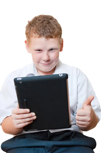 Niño sosteniendo una tableta —  Fotos de Stock