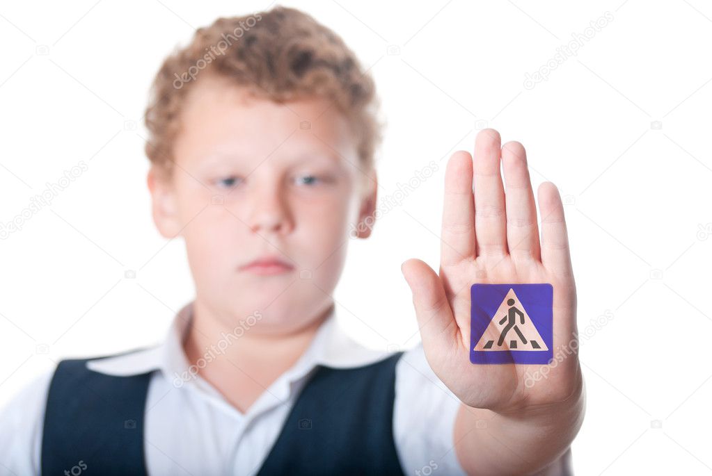 Boy shows shows the sign 