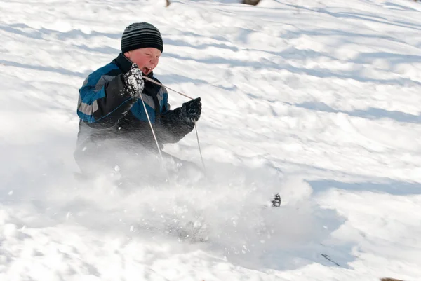 A child rolls a mountain on a sled — Stock Photo, Image